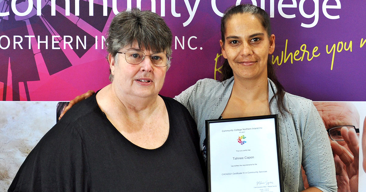 Tahnee Capon holds her Community Services certificate alongside Rural Outreach and Support Service Manager Vicki Higgins at Community College Northern Inland’s Inverell campus.